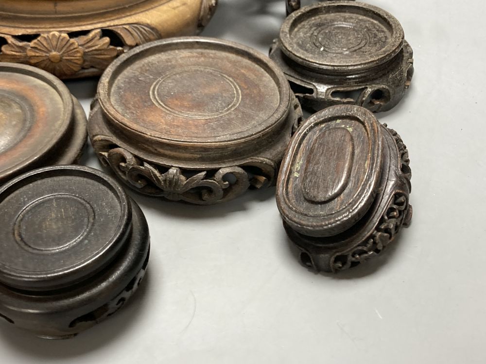 A quantity of Chinese carved wood stands